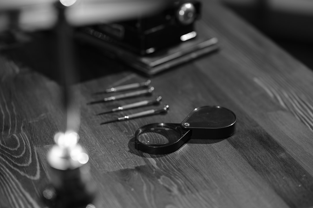 a black and white photo of a pair of scissors
