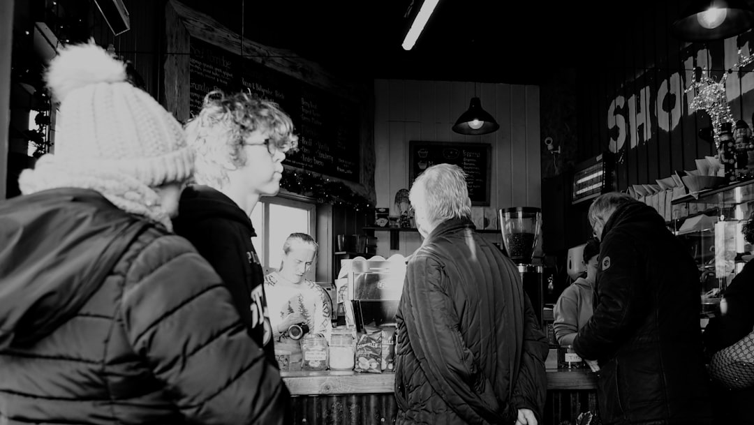 People gathered at a bar counter indoors